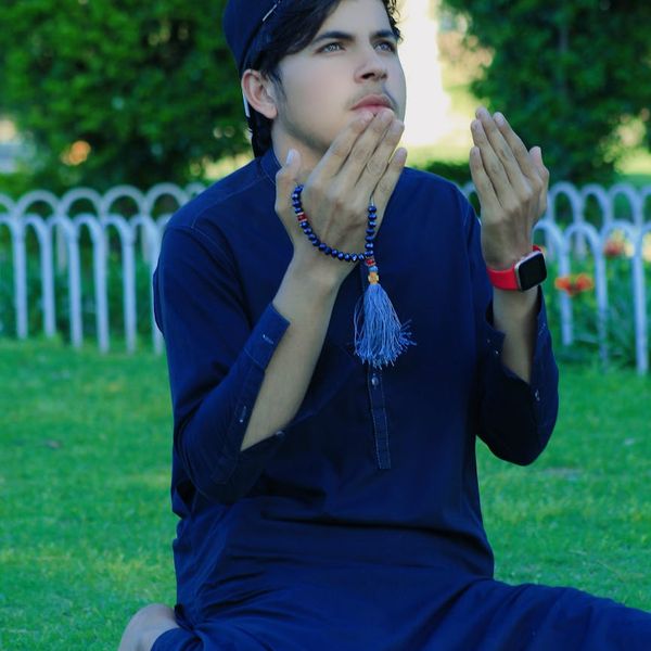 Man outdoors in a calm, meditative pose, representing mental clarity.